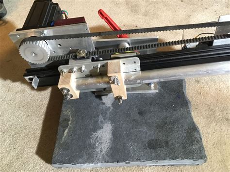 Posted on November 27, 2016 by shagmatic. I am working on a new compact machine that uses a timing belt and Vee rail instead of a drive wheel. It also uses a double stack nema 24 motor (a nema 23 could be used instead but has a smaller shaft) So far the machine looks like a very reasonable design.